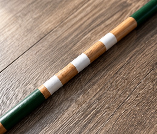 Close-up of the green and white markings on natural wood