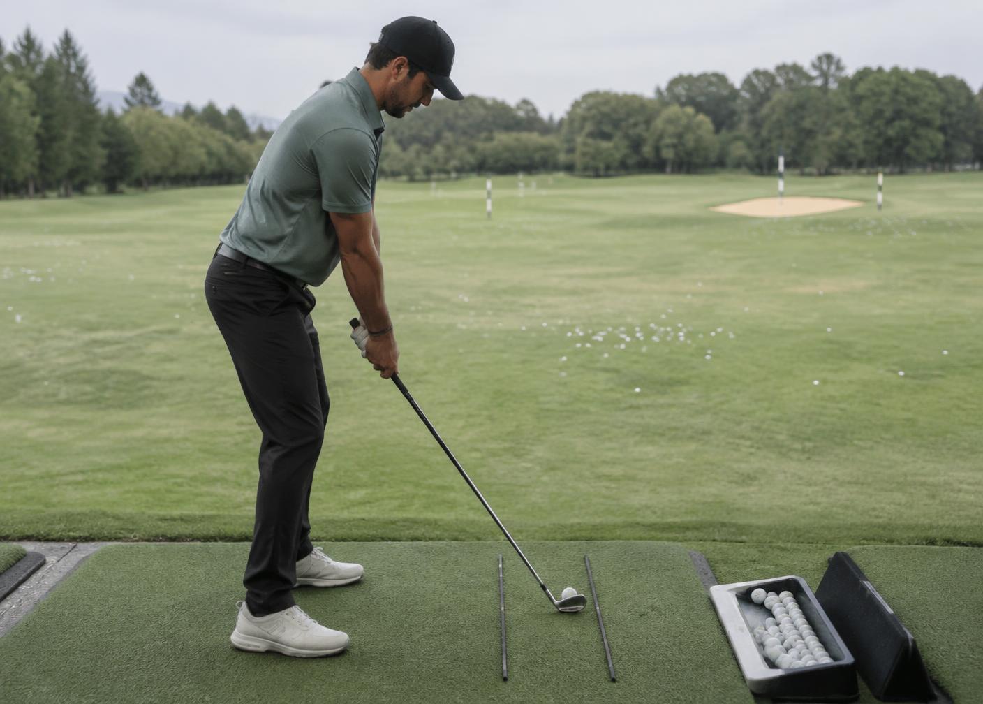 Alignment sticks in use at the driving range